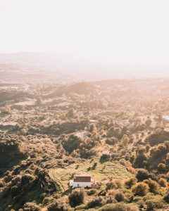 A breathtaking aerial view of the lush countryside in Mijas, Spain, captured at sunset.